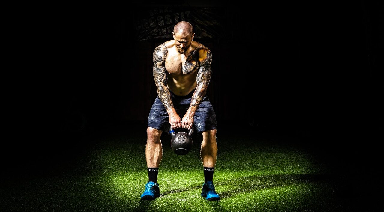 Home Page Man Performing Kettlebell Swings